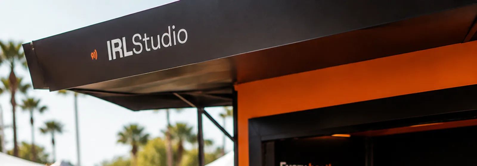 An IRL Studio sampling booth at an outdoor summer festival